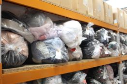 Twelve bags of pre-owned clothing and related items.