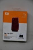 A boxed as new WD My Passport 1TB portable SSD.