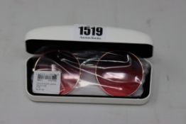 A pair of as new Calvin Klein sunglasses.