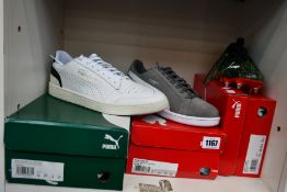 Three pairs of as new Puma trainers; Smash SD (UK 9). Ultra 1.2 MxSG (UK 5.5) and Ralph Sampson Lo