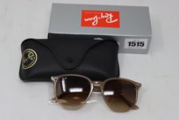 A pair of as new Ray Ban sunglasses.