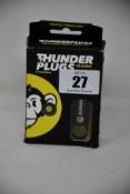 A Bananaz Classic Thunder party earplugs with music filter.