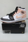 A pair of as new Nike Air Jordan 1 Mid (UK 9).