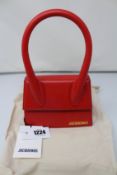 An as new Jacquemus Le Chiquito Moyen bag in red.