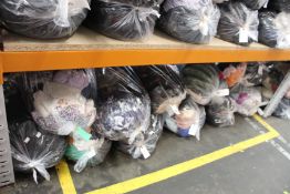 Twelve bags of pre-owned clothing and related items.