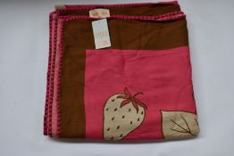 An as new Karen Mabon X Peter Rabbit woven raspberry blanket, part of a limited-edition capsule