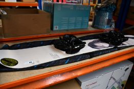 A pre-owned ICON snowboard with travel bag.