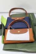 Two as new Longchamps folding tote bags.