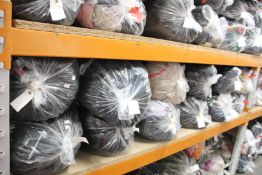 Twelve bags of pre-owned clothing and related items.