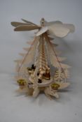 A boxed as new Dregeno wooden display pyramid with a Christmas figure (085/629).