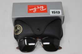 A pair of as new Ray Ban sunglasses.