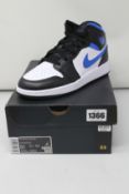 A pair of youths as new Nike Air Jordan 1 Mid with authentication card (UK 5).