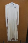An as new Ralph Lauren Polo turtle neck pleated dress in cream (L).
