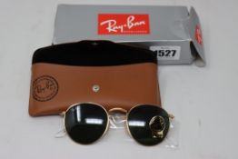 A pair of as new Ray Ban sunglasses.