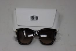 A pair of as new Michael Kors sunglasses.
