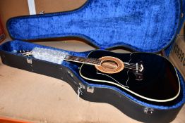 A pre-owned Ibanez Concord 752 'Black Beauty' Acoustic Guitar with case and some accessories.