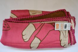 An as new Karen Mabon X Peter Rabbit woven raspberry blanket, part of a limited-edition capsule