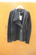 An as new Proenza Schouler Asymmetrical Lapel blazer in black (Size US 0 - RRP £693).