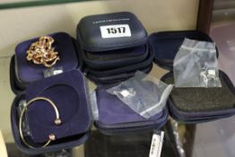 Five items of as new Tommy Hilfiger jewellery; a bangle, a bracelet and three pairs of earrings.