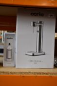 An Aarke Carbonator 3 with water bottle in a steel finish.