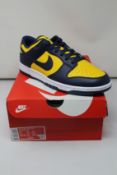 A pair of as new Nike Dunk Low Retro with authentication tag (UK 10).