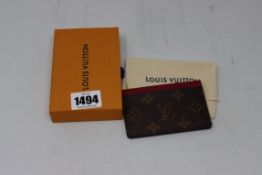An as new Louis Vuitton leather card holder.