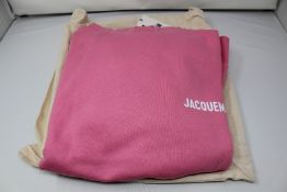 An as new Jacquemus Le Sweatshirt hoodie in pink (XXXL) and a pair of Jacquemus socks.