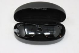 A pair of as new Ralph Lauren sunglasses.