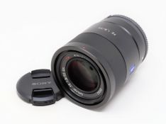 A boxed as new Sony FE 55mm f/1.8 ZA E-Mount Lens (P/N: SEL55F18Z).