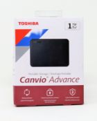 A boxed as new Toshiba Canvio Advance 1TB External Storage Drive in Black (Box sealed, some damage