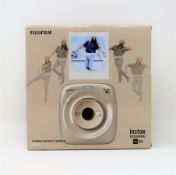 A boxed as new Fujifilm Instax Square SQ20 Hybrid Instant Camera in Beige.