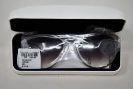 A pair of as new Calvin Klein sunglasses.