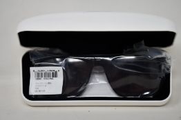 A pair of as new Calvin Klein sunglasses.