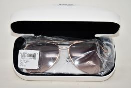 A pair of as new Calvin Klein sunglasses.