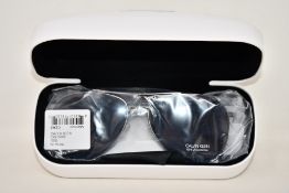A pair of as new Calvin Klein sunglasses.