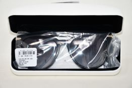 A pair of as new Calvin Klein sunglasses.