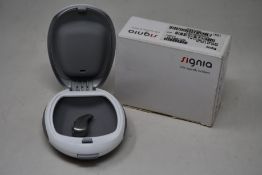 A boxed Signia Pure 13 7 NX (T) RIC hearing aid (REF: 10951131).