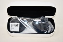 A pair of as new Calvin Klein sunglasses.