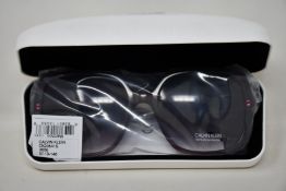A pair of as new Calvin Klein sunglasses.