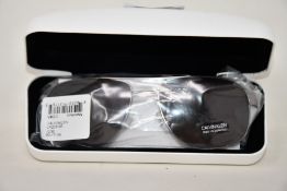 A pair of as new Calvin Klein sunglasses.