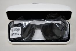 A pair of as new Calvin Klein sunglasses.