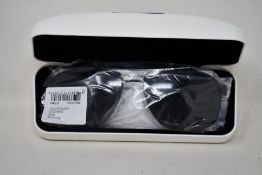 A pair of as new Calvin Klein sunglasses.