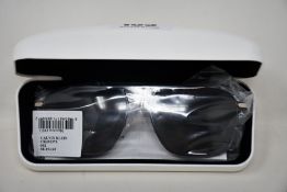A pair of as new Calvin Klein sunglasses.