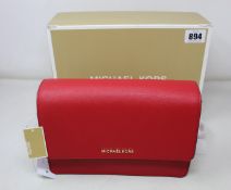 An as new Michael Kors Daniela bag in red.