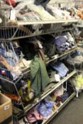 A quantity of assorted as new clothing and related items.