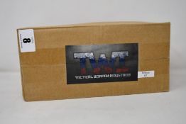 A TWI airsoft Bullpup conversion kit (NOTE: The airsoft this kit is used for is unknown, viewing