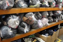 Twelve bags of assorted clothing and related items.