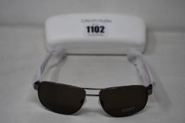 A pair of as new Calvin Klein sunglasses.