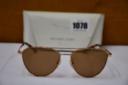 A pair of as new Michael Kors sunglasses.