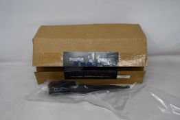 A TWI airsoft Bullpup conversion kit (NOTE: The airsoft this kit is used for is unknown, viewing